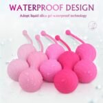 Spiral texture detail of pink weighted kegel balls